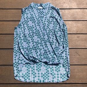 Light and breezy wrap front sleeveless blouse.